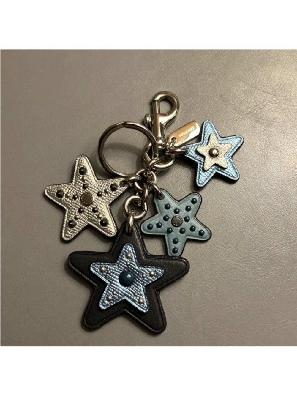 Coach cluster charm keychain, crystals, different hues of blue, silver, gunmetal